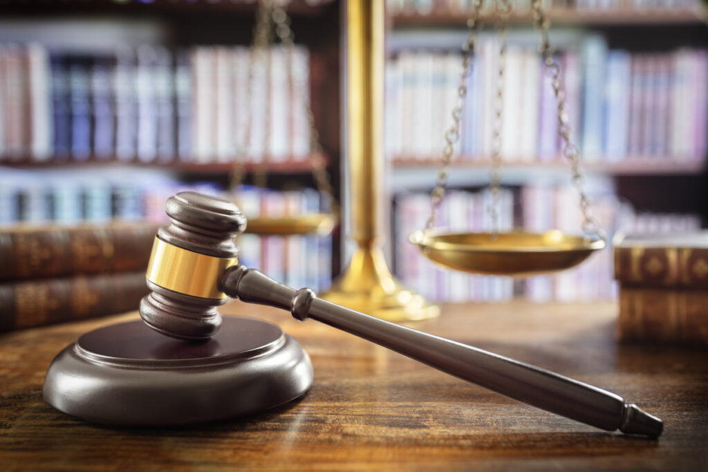 Legal sector, gavel and law books on a desk